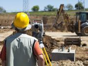 Picture of a construction worker building a road.