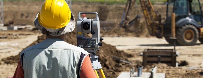 Picture of a construction worker building a road.