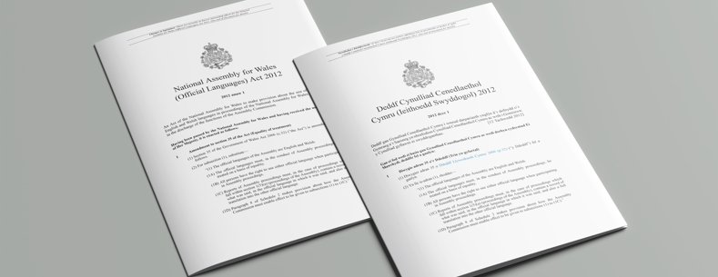 The article’s main image is of English and Welsh versions of the National Assembly for Wales (Official Languages) Act 2012.