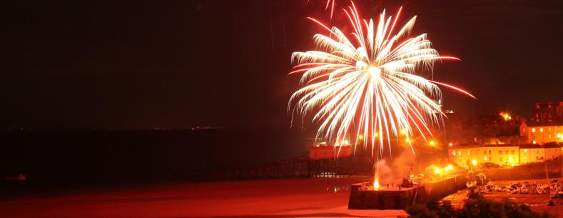 a fireworks explodes over Tenby pier