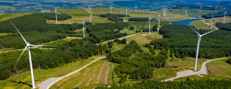 Aerial view of wind turbines in upland Wales