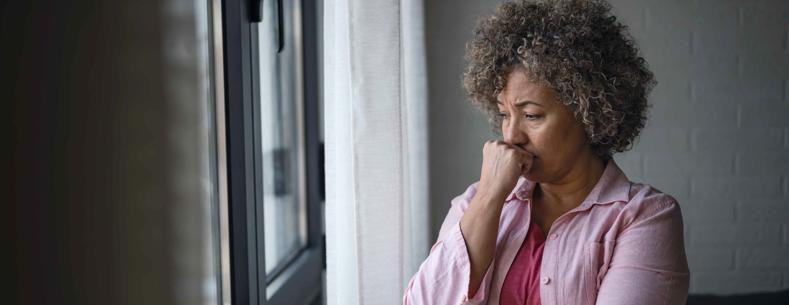 Woman looking out of window