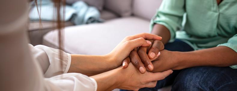 A person holding a hand of another person