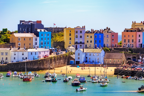 Image of Tenby harbour with colourful buildings.