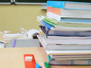 Image of school books on a desk 