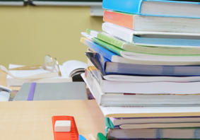 Image of school books on a desk 