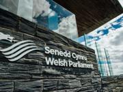 The Senedd Cymru - Welsh Parliament sign outside of the Senedd