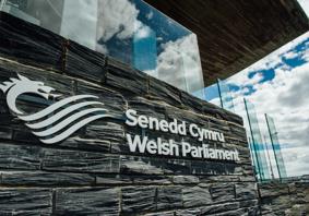 The Senedd Cymru - Welsh Parliament sign outside of the Senedd