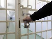 A prison gate being locked
