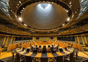 The Senedd chamber from inside looking up to the light outside.