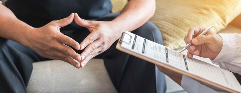 An image of two people at a therapist appointment