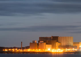 A landscape photograph of the old Wylfa power station at night.