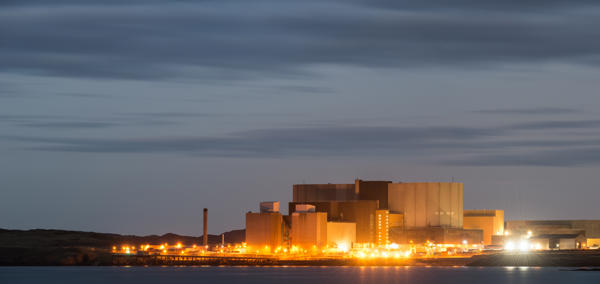 A landscape photograph of the old Wylfa power station at night.
