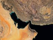 The article's main image is a colour satellite image of the Strait of Hormuz