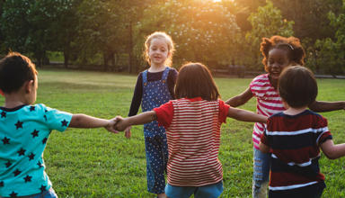 Children holding hand in a circle