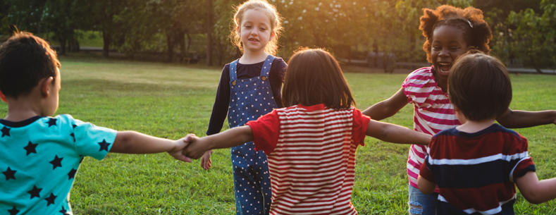 Children holding hand in a circle